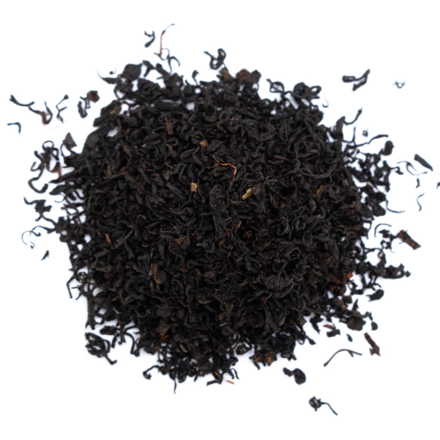 Loose Blueberry Tea Leaves A pile of loose blueberry tea leaves arranged on a white background.