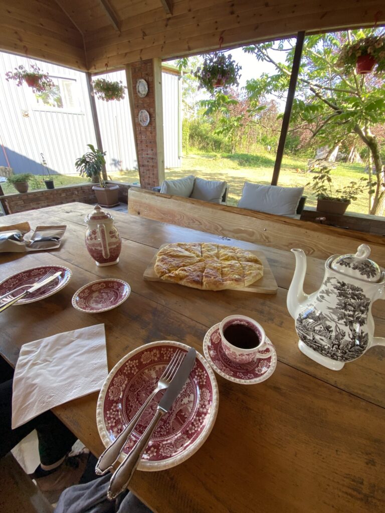 Fresh khachapuri and hot tea in the tasting patio