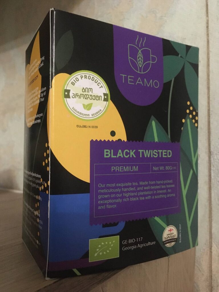 Black Twisted premium tea box with a colorful design and organic certification label.